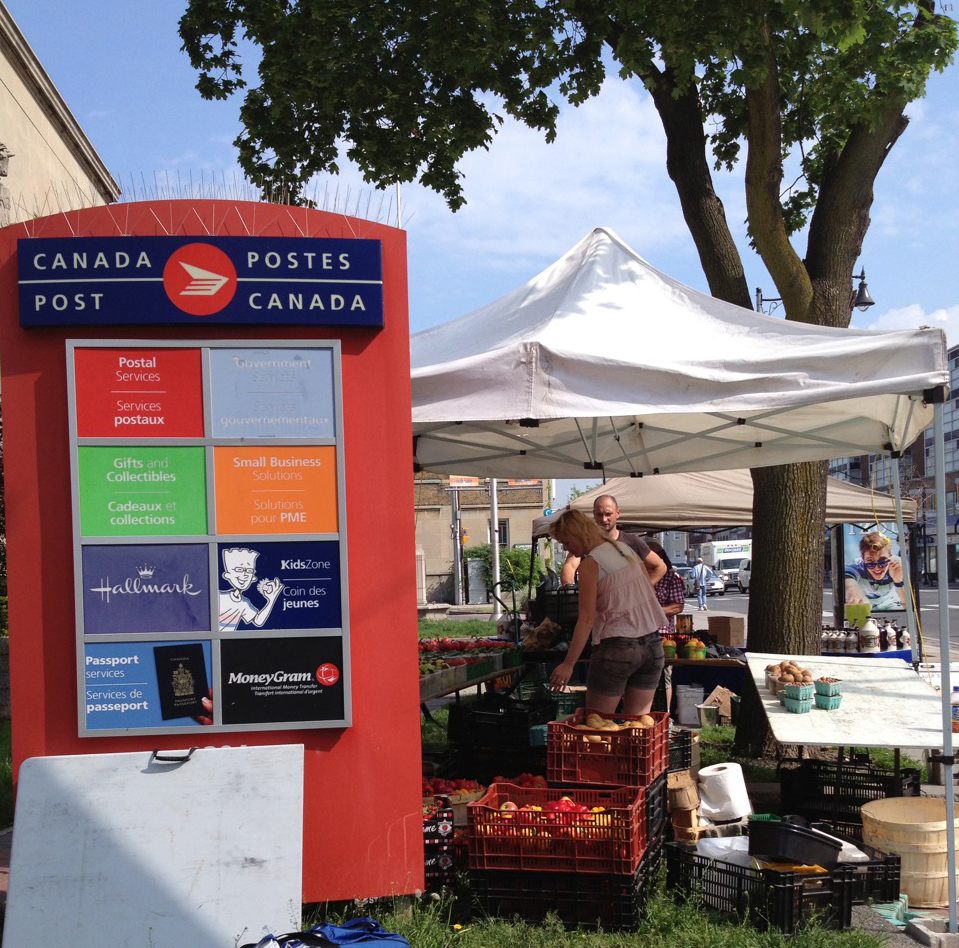 Uptown farmers market sign.