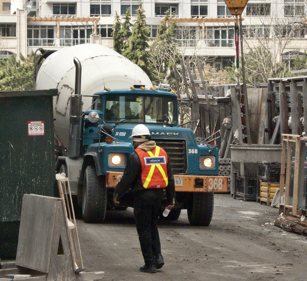 Cement truck and worker.