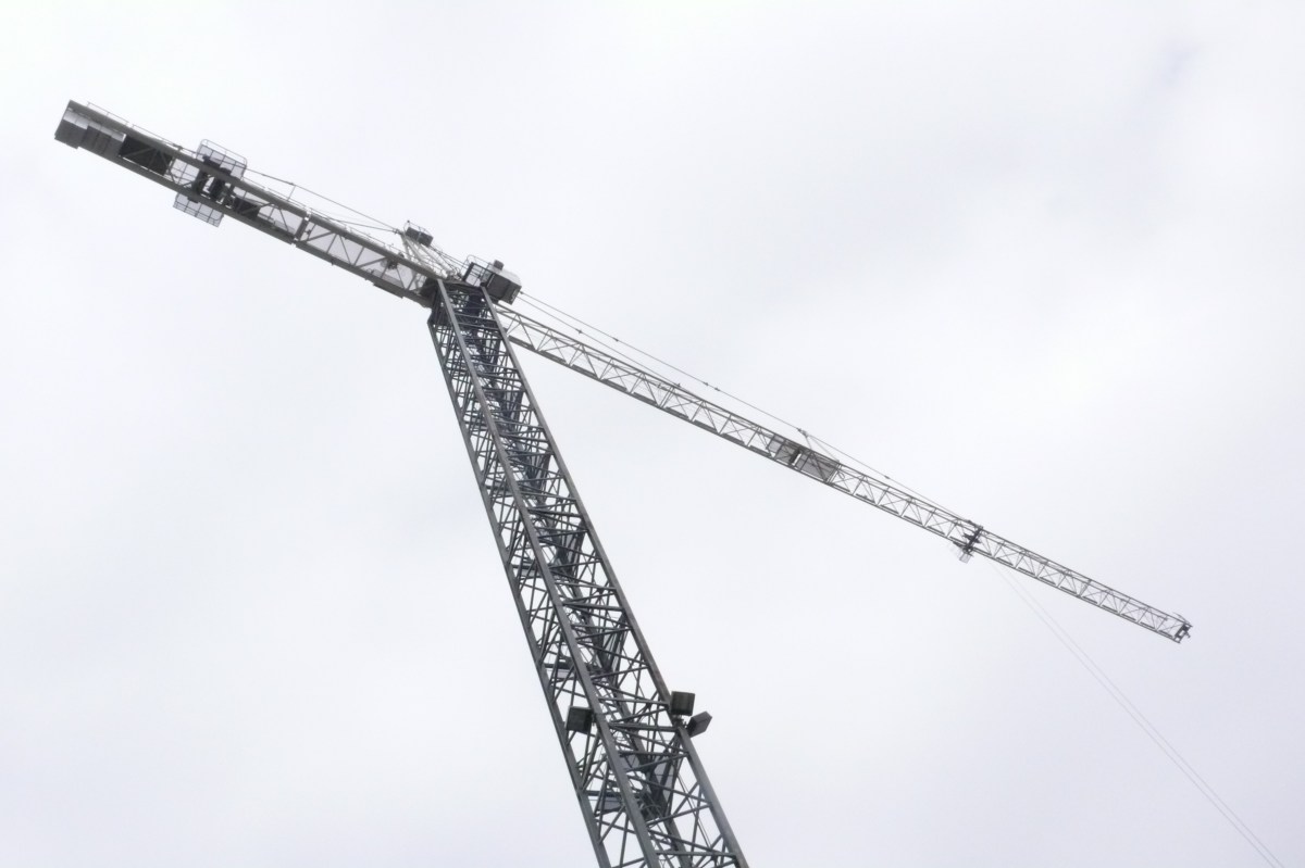 Crane in grey clouds.