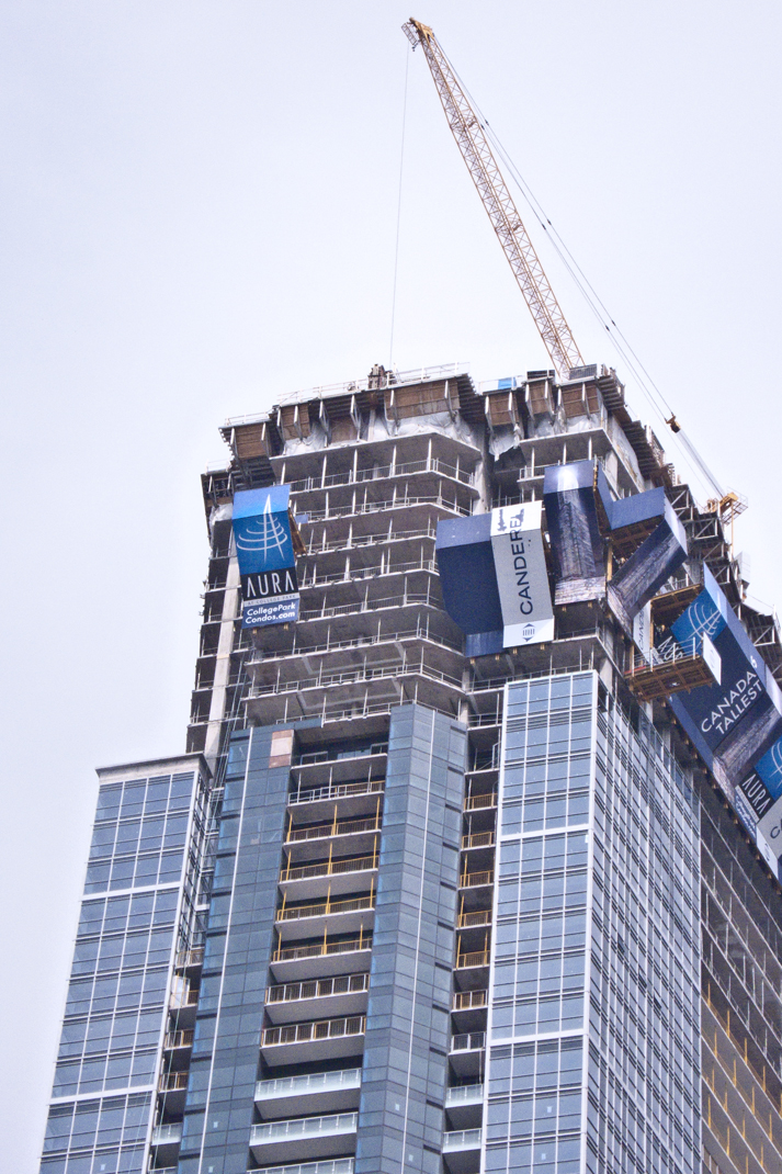 Crane atop building.