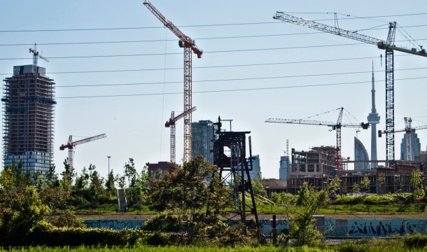 Many cranes and CN tower.
