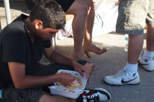 Boy eating on the street
