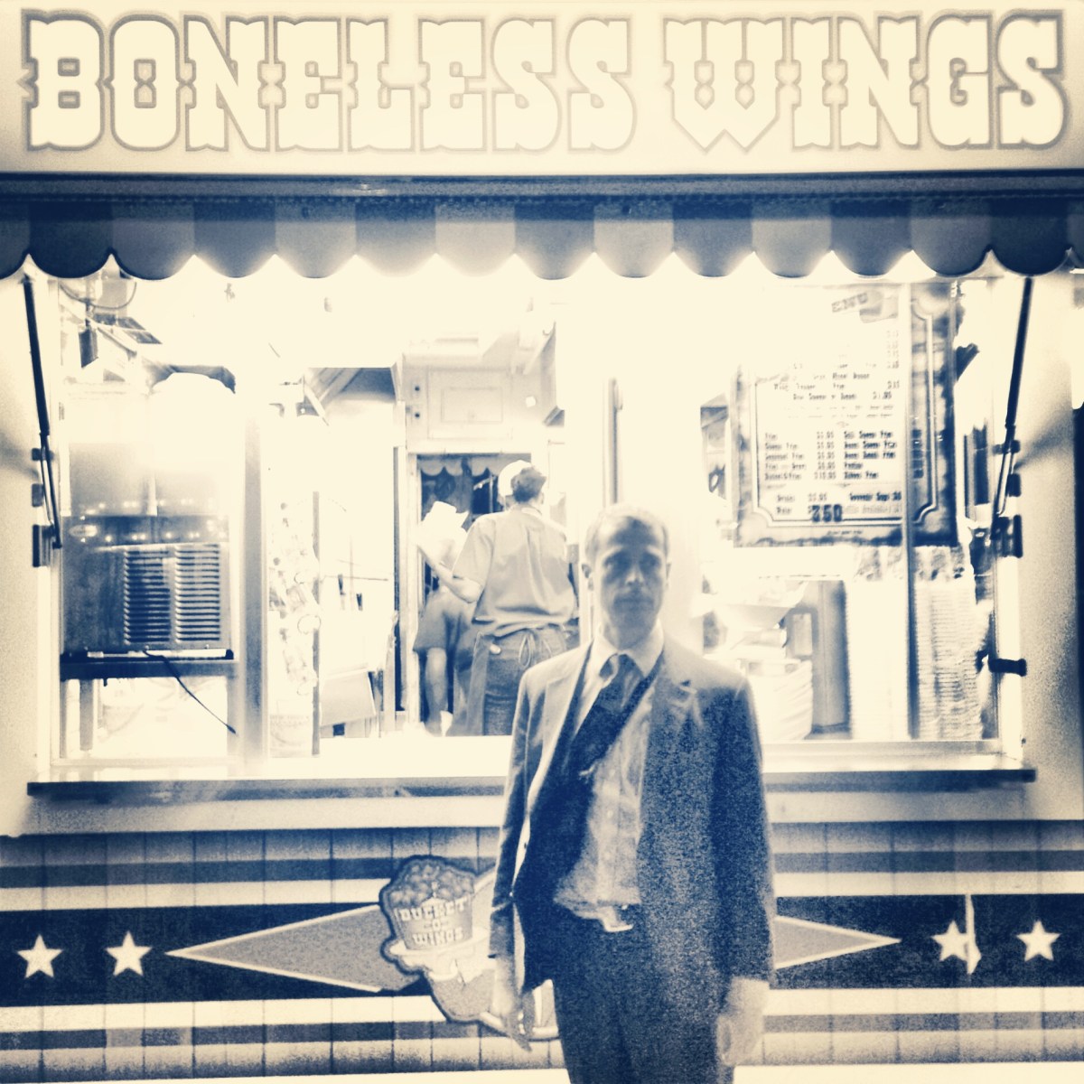 Man standing by booth at the CNE.