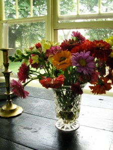 Flowers at the open window.