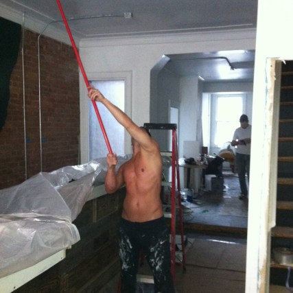 Painting the ceiling at Boxcar Social.