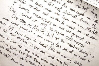 Student writing in Micah Lexier art.