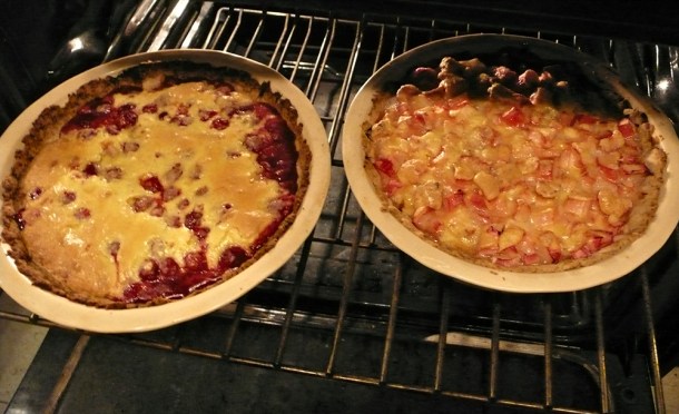 Two baked pies in oven.