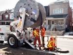 Hydro workers at manhole.