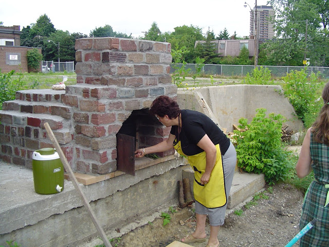 Nikki checking out pizza oven.