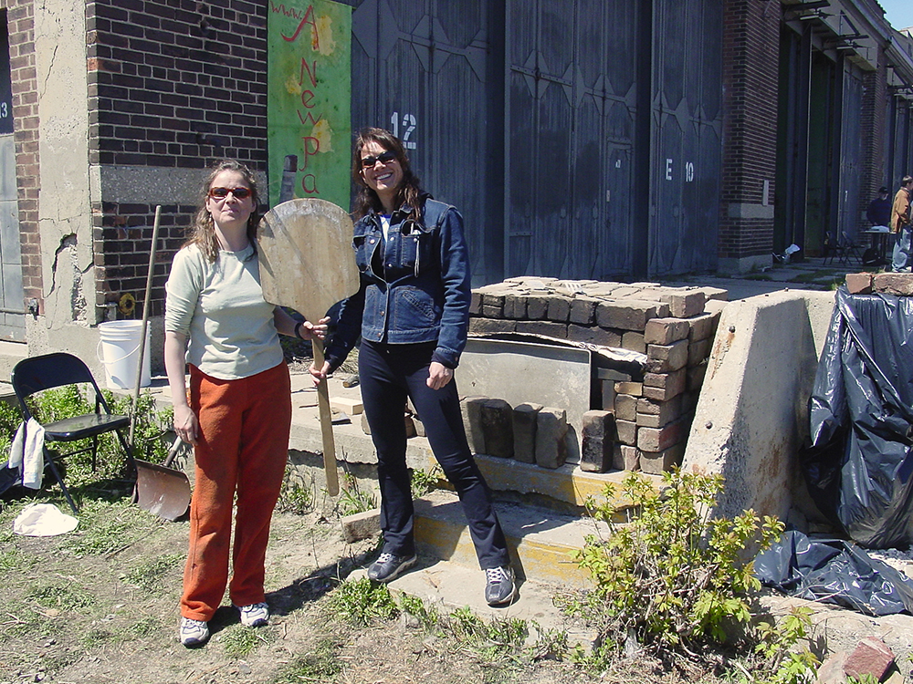 Pizza makers at temporary oven.