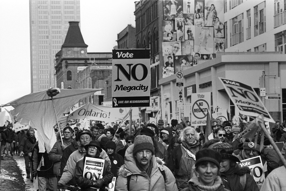 March near Wellesley on Yonge St. against the megacity.