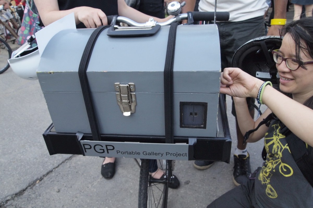 Miniature art gallery on bike.