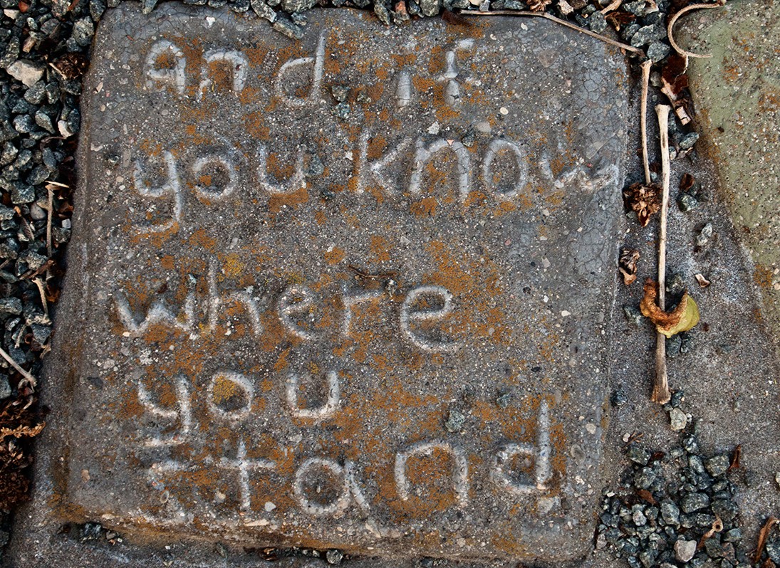 Lettered cement tile .