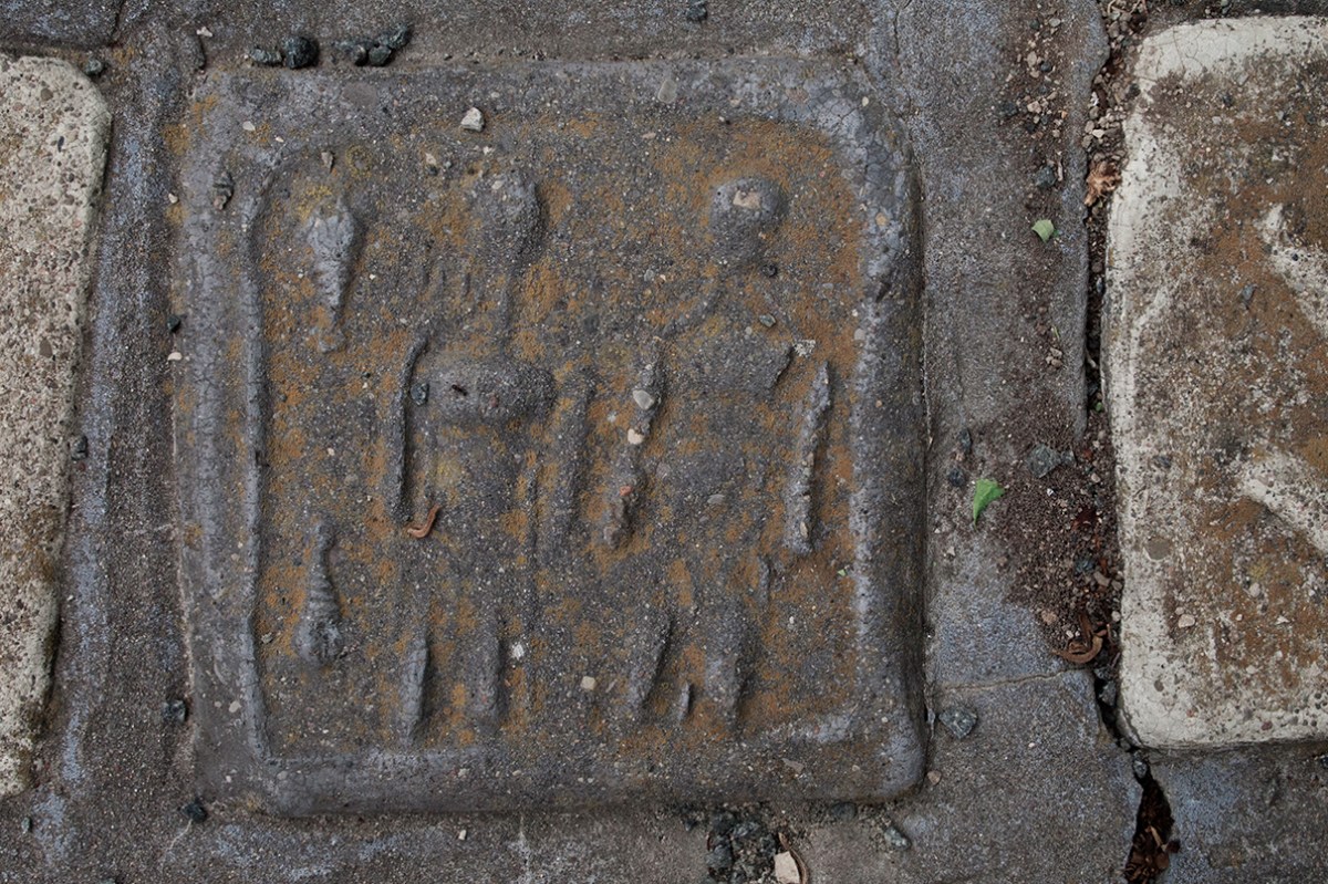 Black figures tile.
