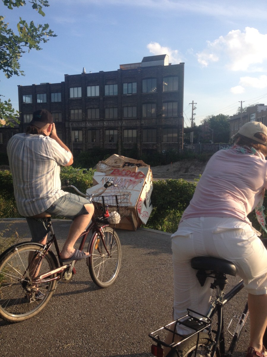 Bike riders taking pictures.