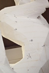 Sculture with markings for measurement.