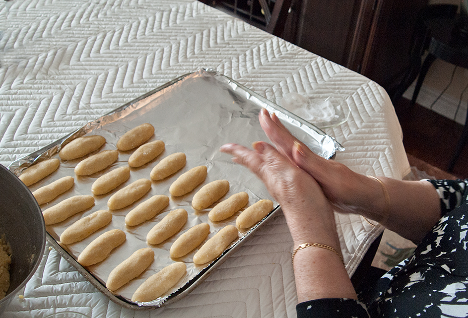 Hands shaping cookie.