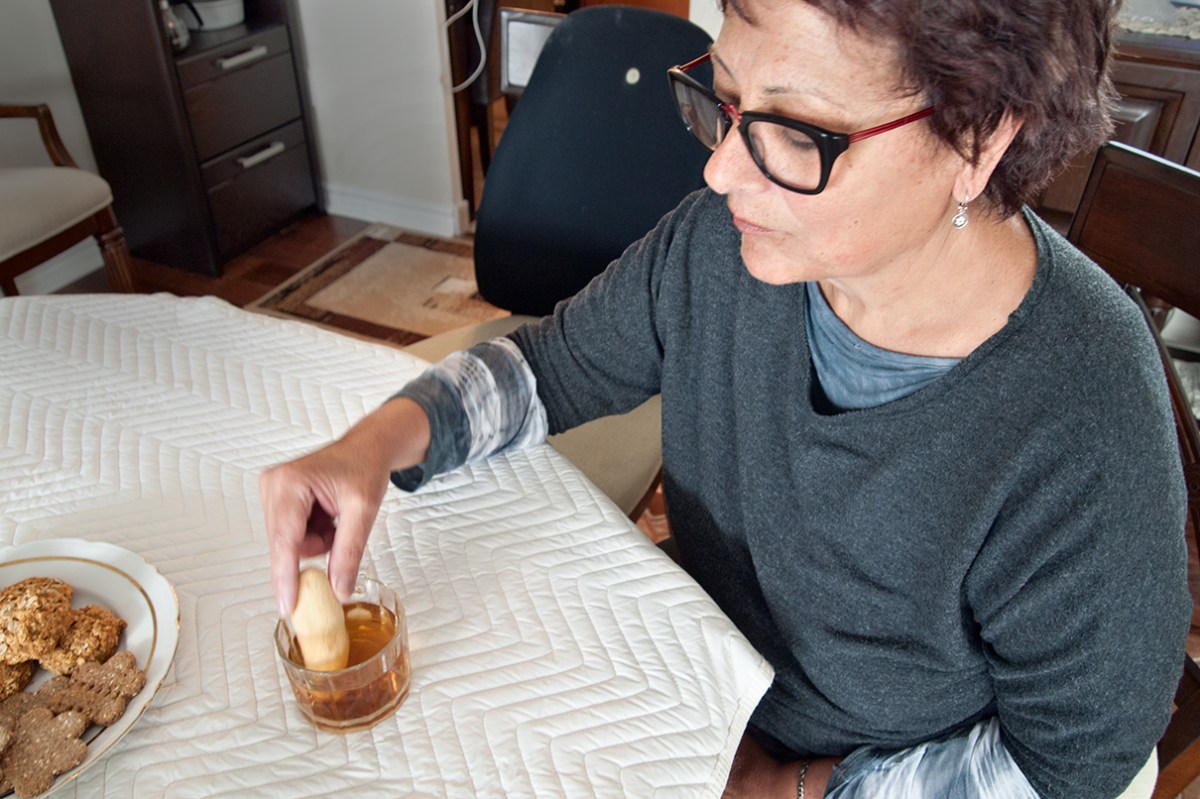 Dunking cookie in tea.