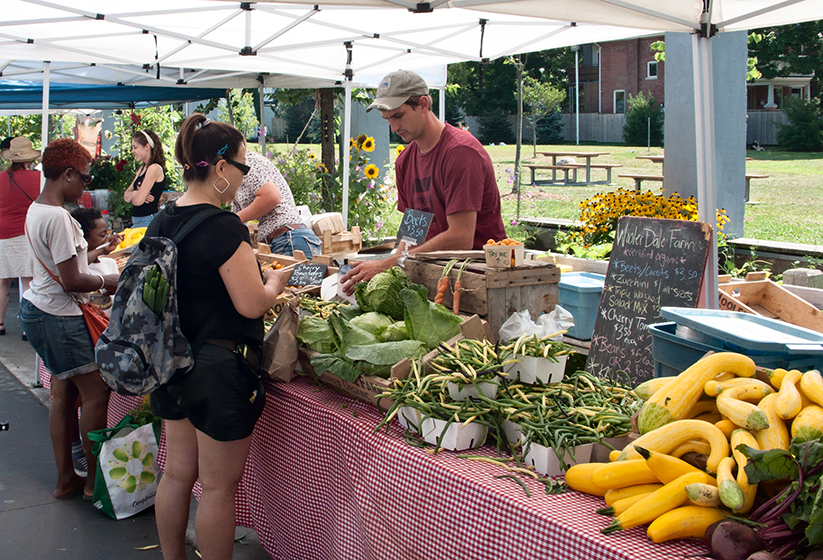 Farmer selling produce.