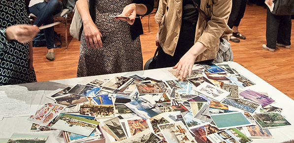Postcards and readers hands.