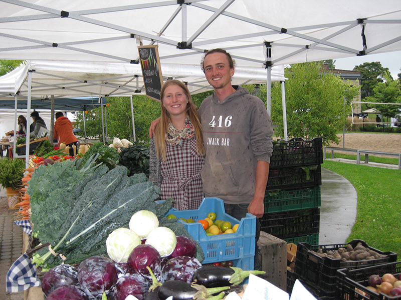 Farmers in their market stall.