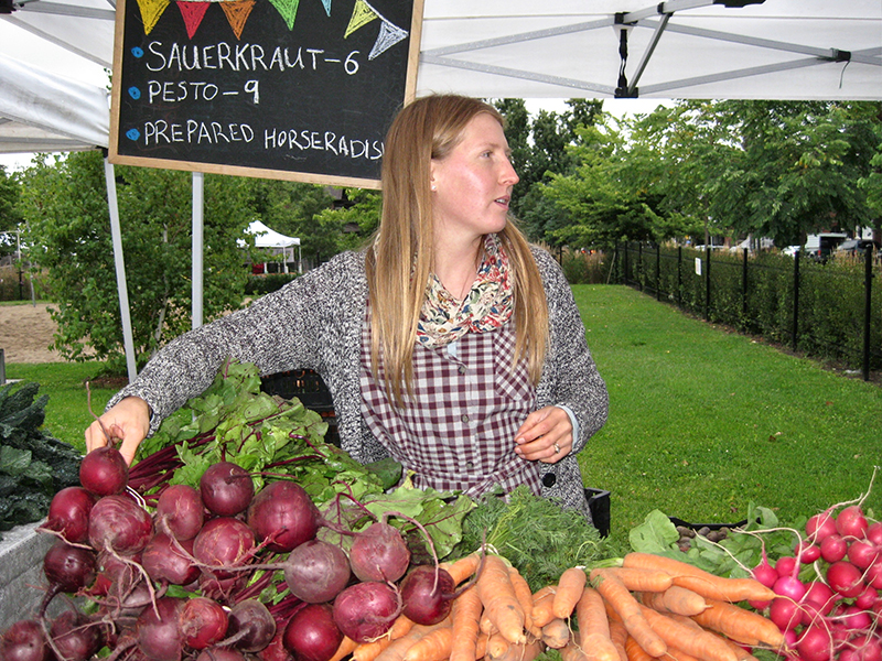 Shira in market stall.