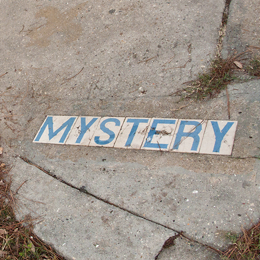 Mystery in sidewalk.