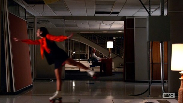Peggy Olsen rollerskating.