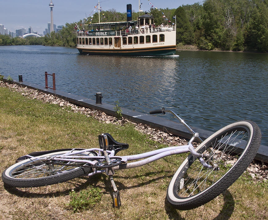 Bike and boat on Toronto Island.