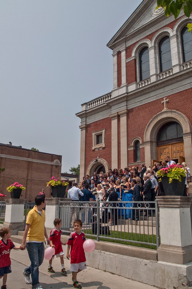 Wedding and passers-by on St. Clair W.