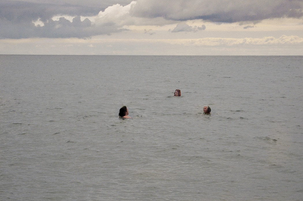 Three swimmers.