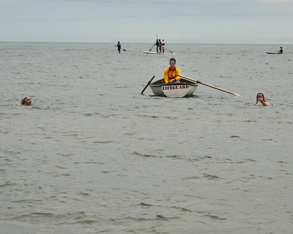 Life guard and swimmers.