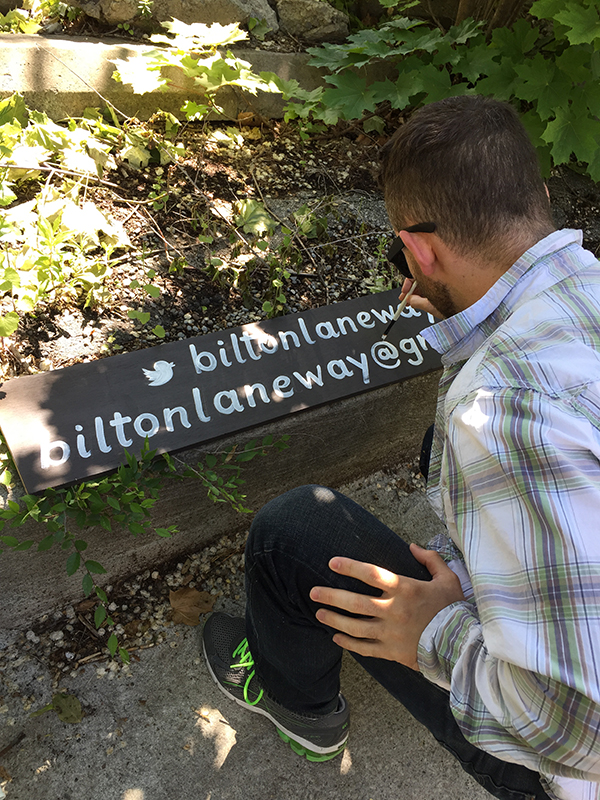 Painting Bilton Laneway sign.