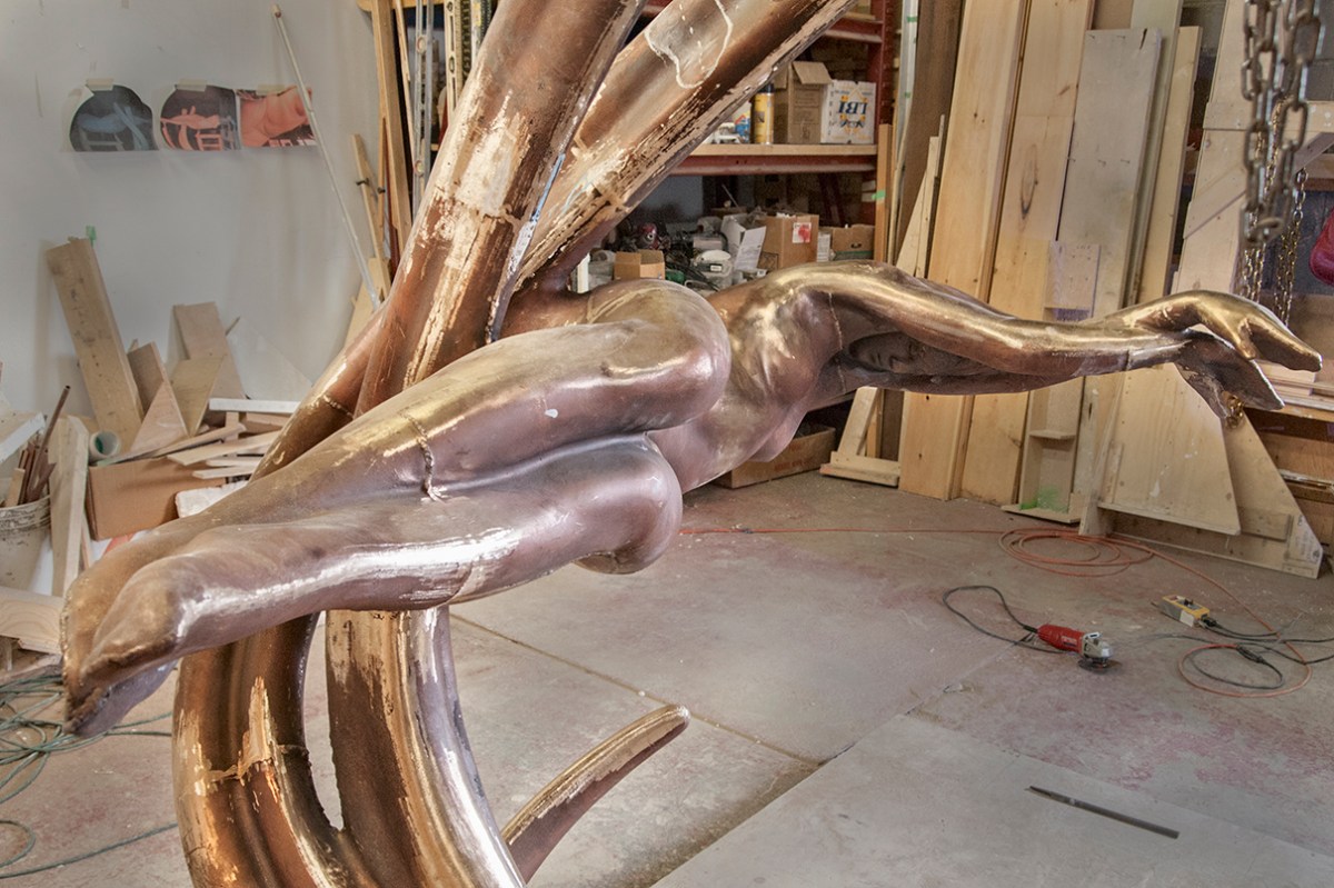 Bronze figure Repose, face visible.