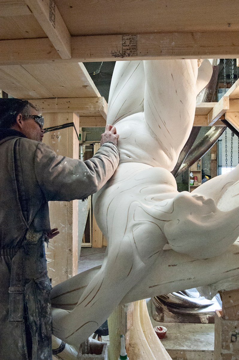 Moyle sanding plaster figure.