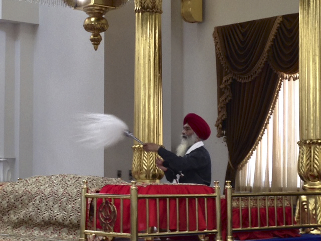 Celebrant with fly swisher.