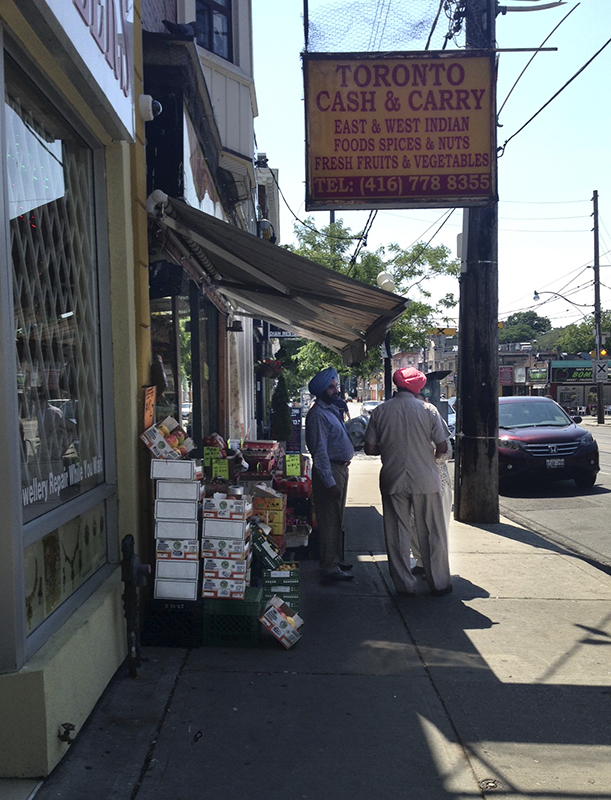 Sikh men at Gerrard St storefront.