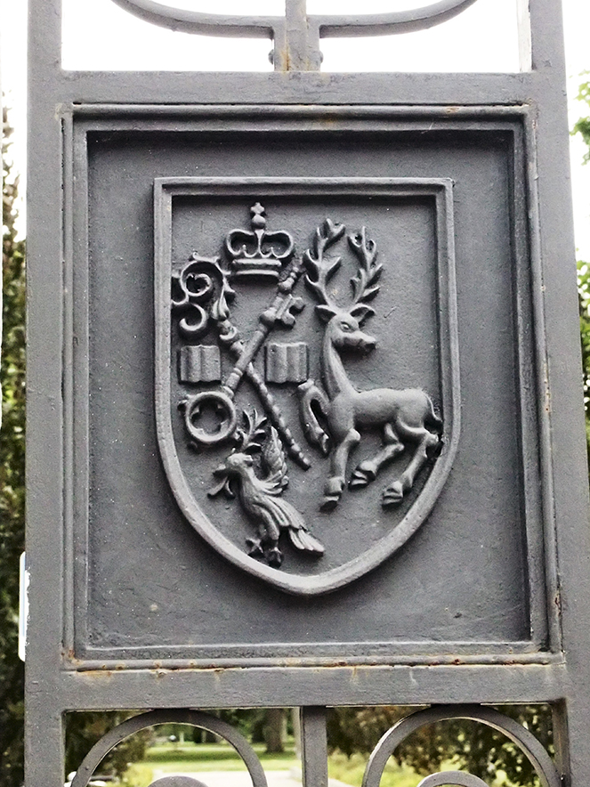 Crest on Trinity Bellwoods fence.