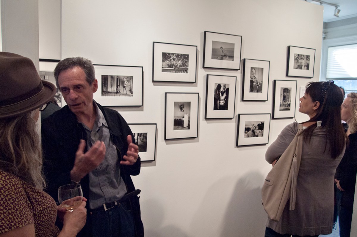 Havana opening, wall of black and white photos.