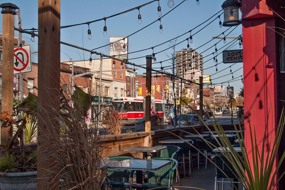 Cafe patio and streetcar on St Clair W.