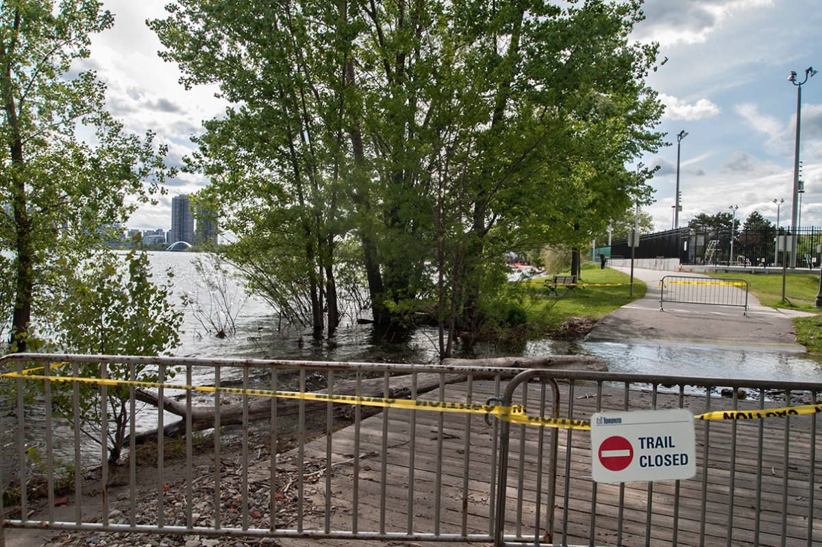 Sunny side beach boardwalk flooded.