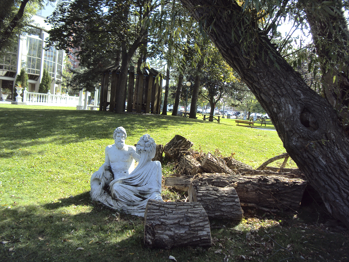 Sculpture beneath tree.