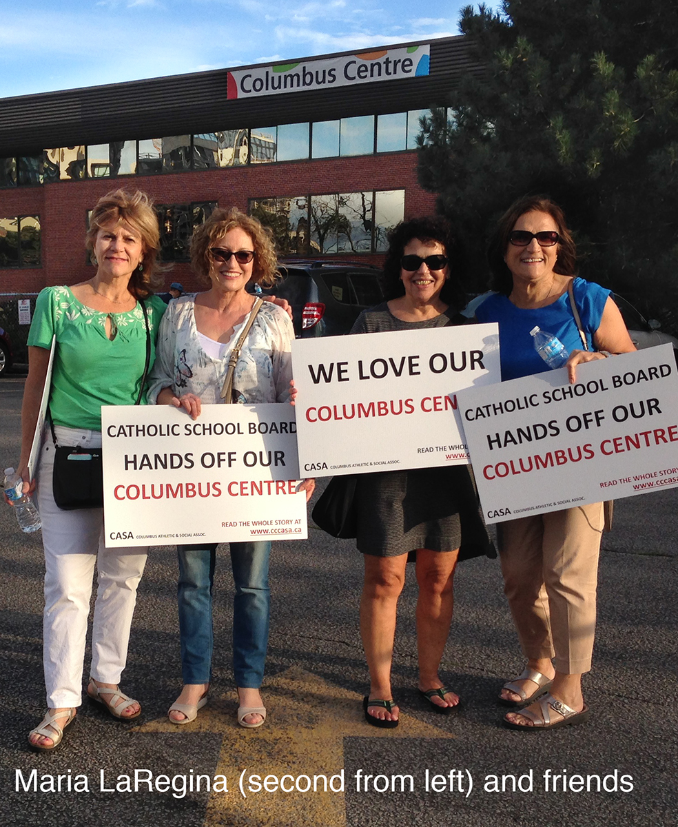 Maria LaRegina and friends with signs.