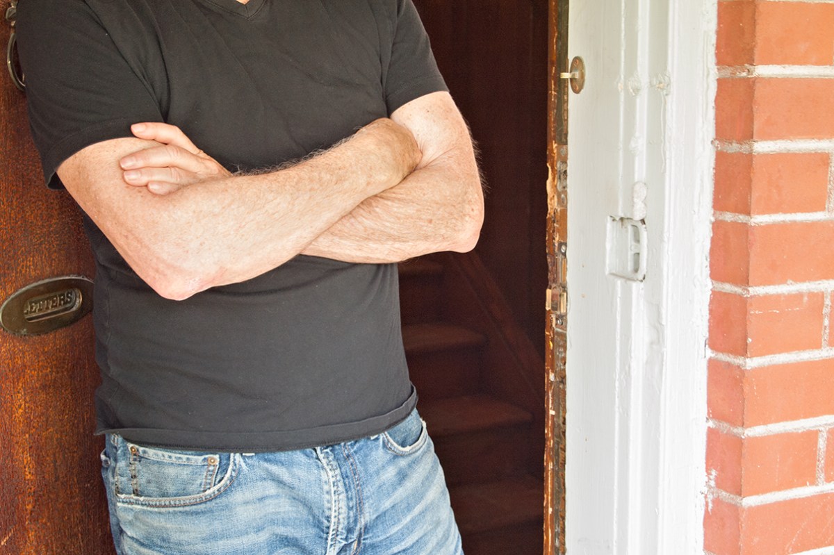 Open door, arms crossed