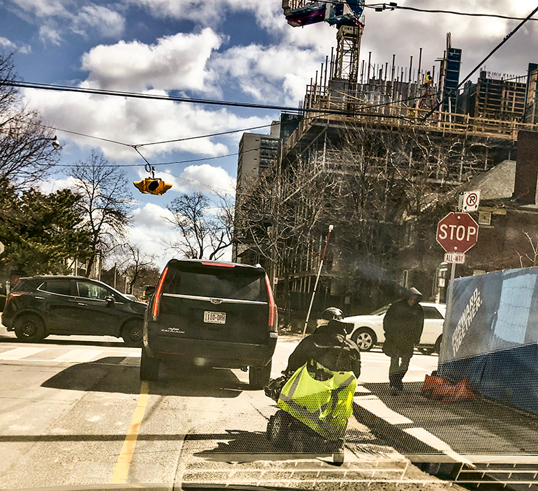 Person in wheelchair forced by construction into the street.