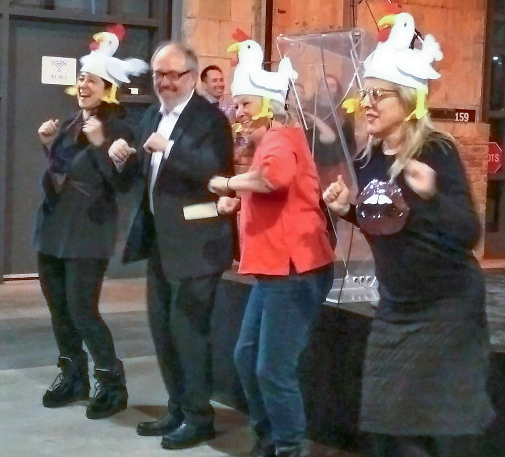 Chicken dance by Joe Mihevc and three women.