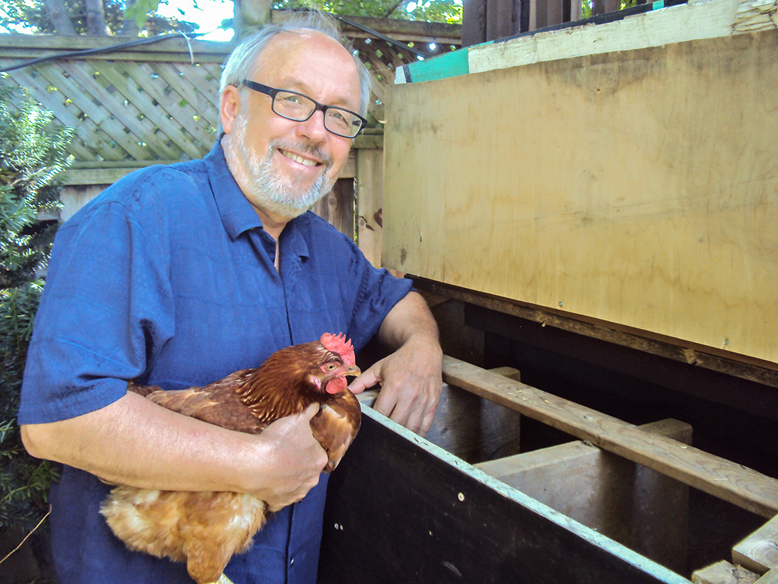Joe holding chicken.