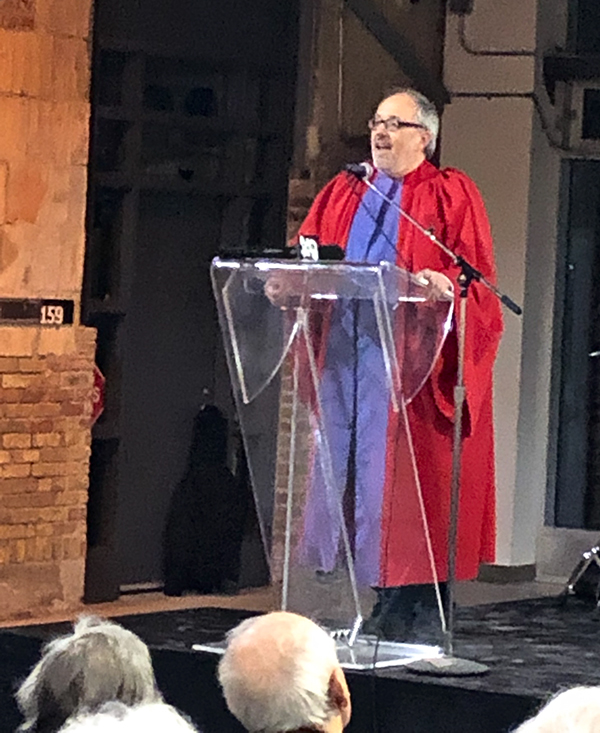 Joe Mihevc giving commencement party speech.